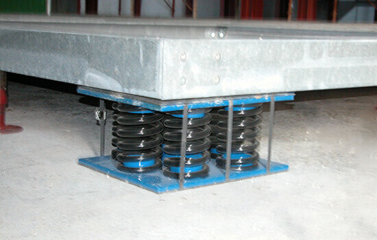 Spring and elastomeric vibration isolation systems